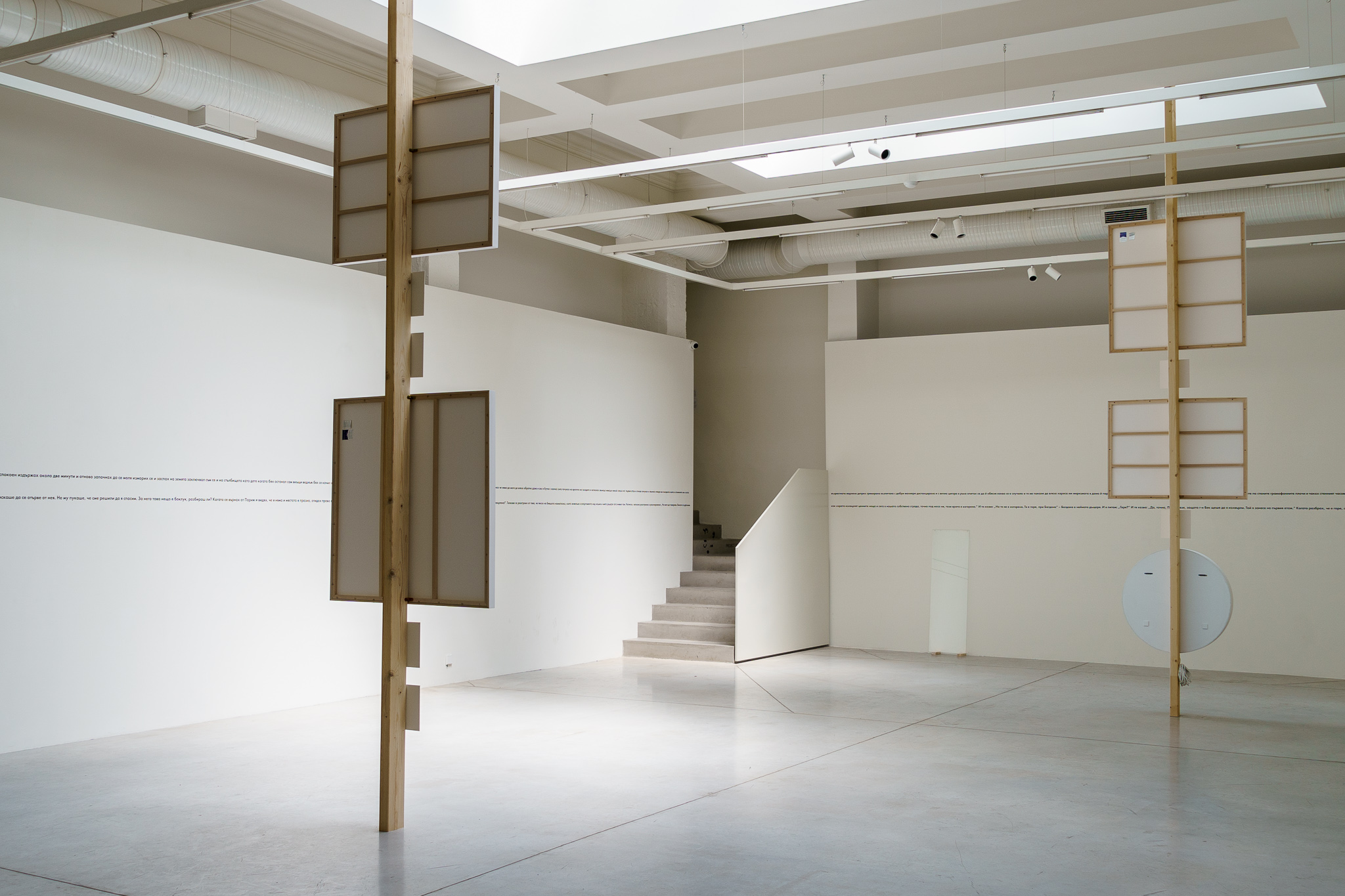 Double Face (Totems), 2022. Installation, wood, photographs on dibond, light box. Exhibition view Structura Gallery, Sofia