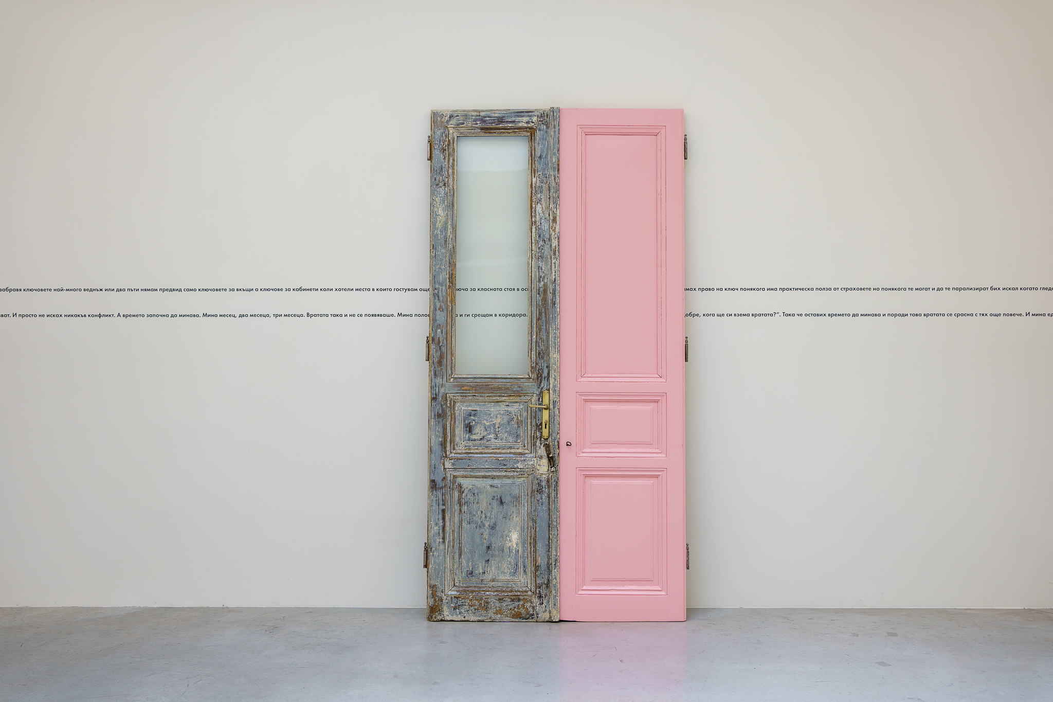 Double Face, 2022. Installation, door, laser cut foil text on a wall, frames, printed text. Installation view, Structura gallery.