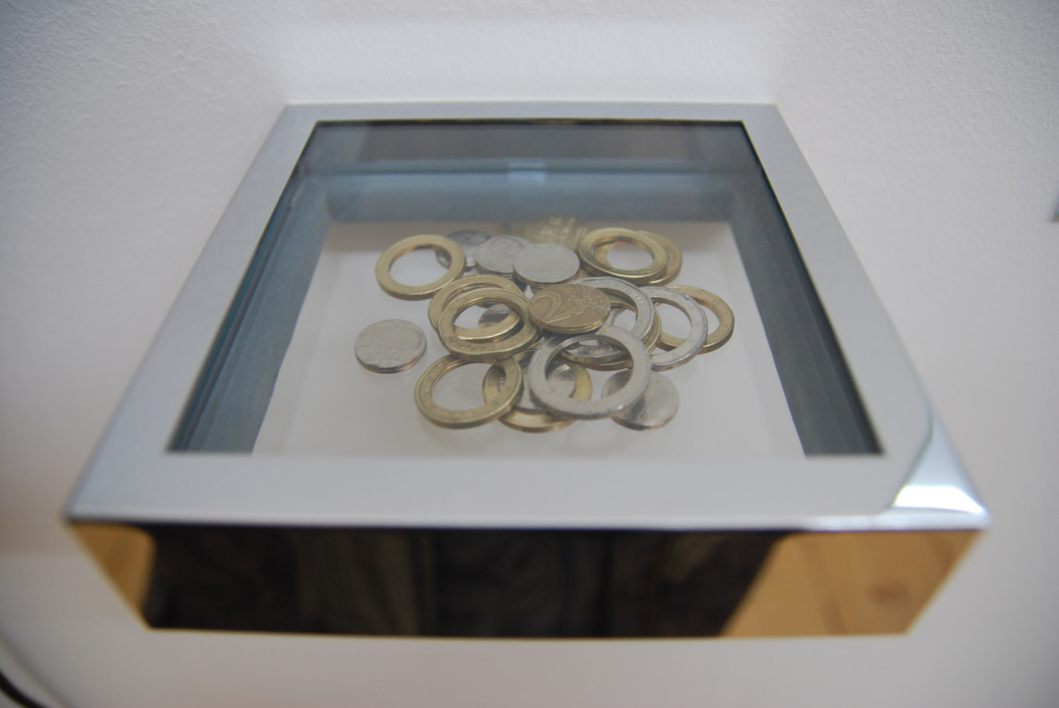Romanian Trick, 2008–2012. Installation, five videos, five certificates of authenticity, coins. Installation view, Artericambi, Verona, 2009.