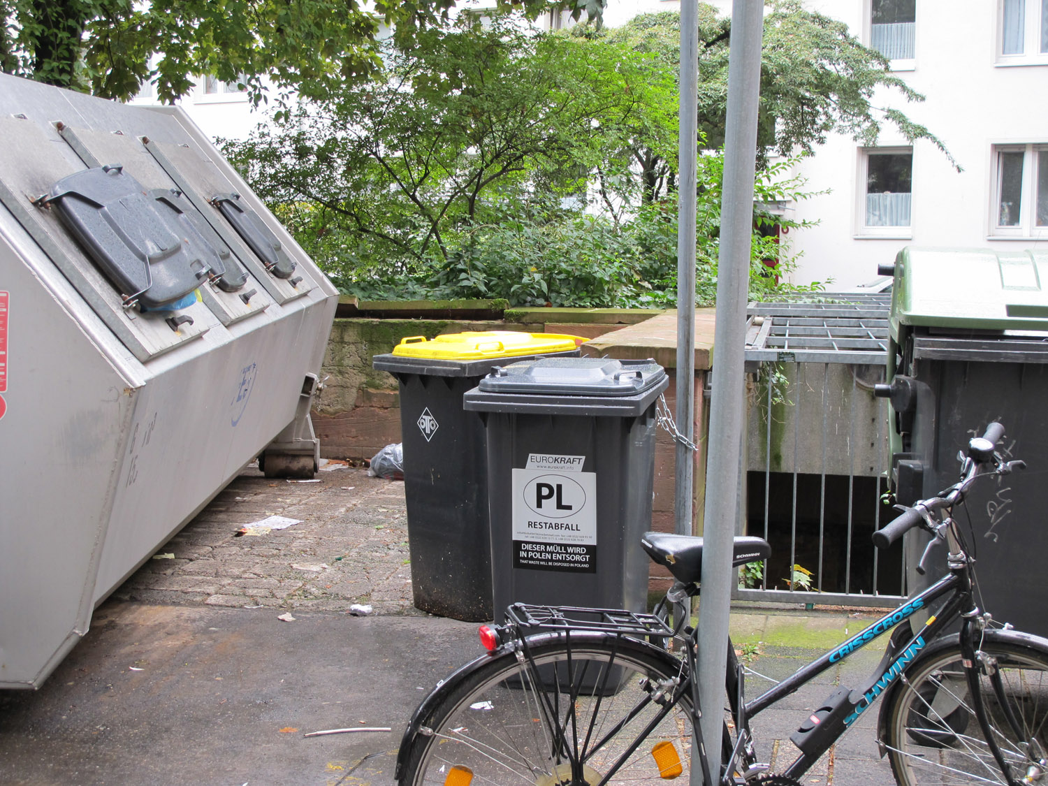 Garbage II, 2010. 6 x 240l garbage containers labeled “Dieser Müll wird in Polen entsorgt.” (“This waste will be disposed of in Poland.”), placed in public spaces in Frankfurt, Germany. Playing The City II. Schirn Kunsthalle, Frankfurt am Main.